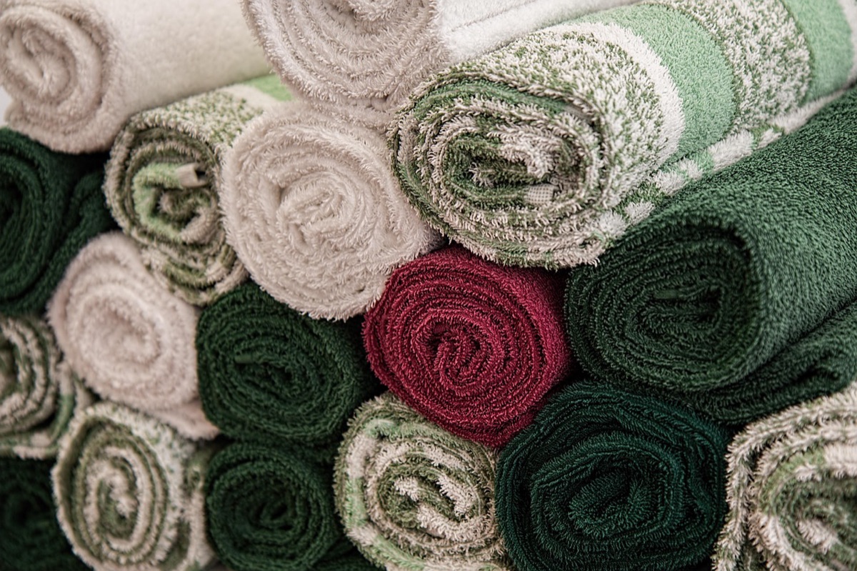 Rolled up towel on tile floor