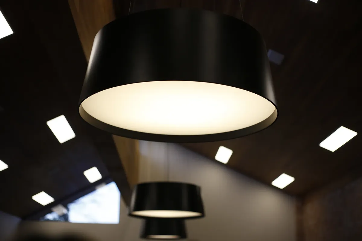 Close-up of modern ceiling lights in a stylish, contemporary interior space.