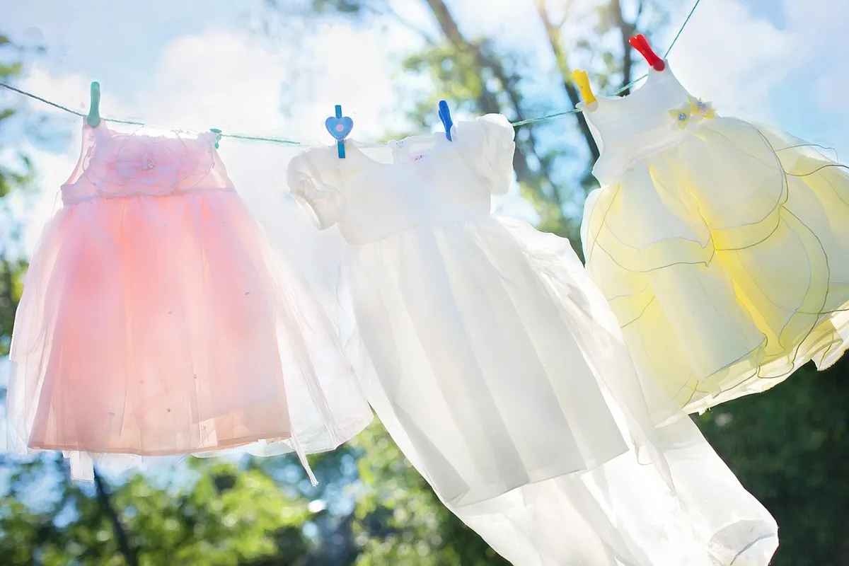 clothesline, little girl dresses, laundry, hang, clothespins, clean, airy, washed clothes, clothing, dresses, children's clothes, clothes